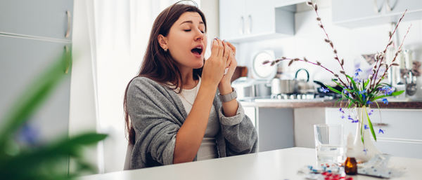 woman sneezing
